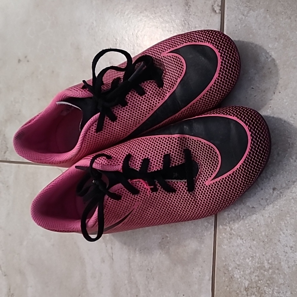 Pink Nike soccer cleats 4Y